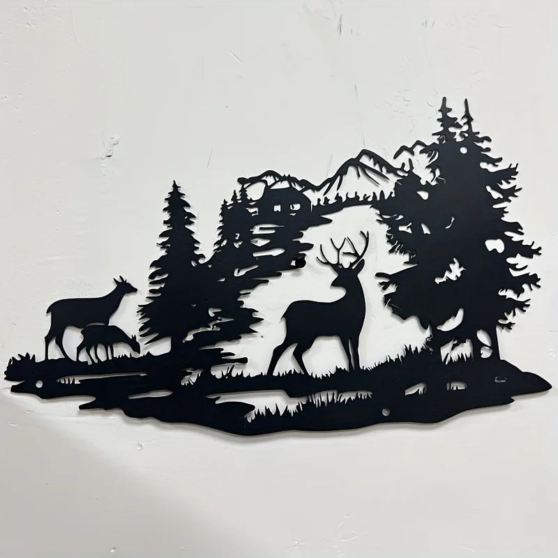 Black silhouette wall art depicting a deer standing in a dense forest with mountains in the background