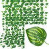 Green artificial ivy vine garland covering a surface and a single leaf