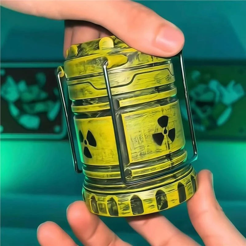 A hand holds a yellow mini nuclear reactor lantern with an eerie green glow against a teal background.