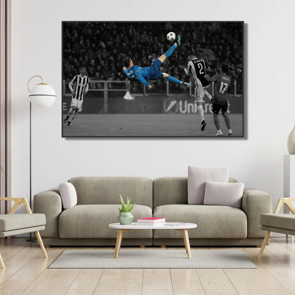 A black and white canvas wall art featuring a dynamic photo of Cristiano Ronaldo playing football.