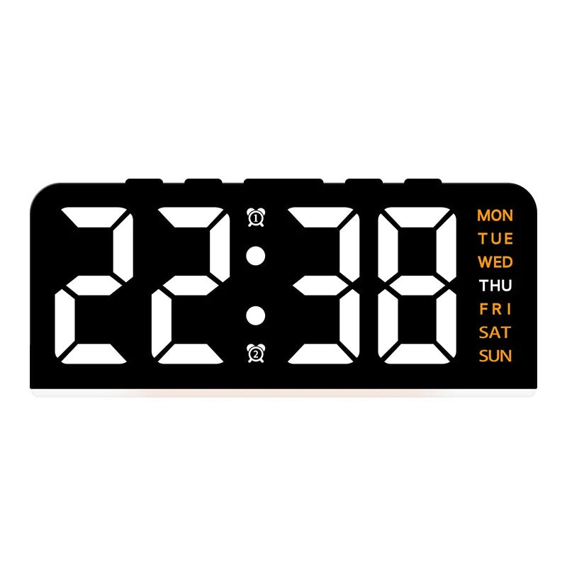 A black digital alarm clock displaying the time 22:38 with day of the week indicators.
