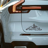 Close-up of a white car's taillight and rear panel featuring black Islamic calligraphy vinyl decal.