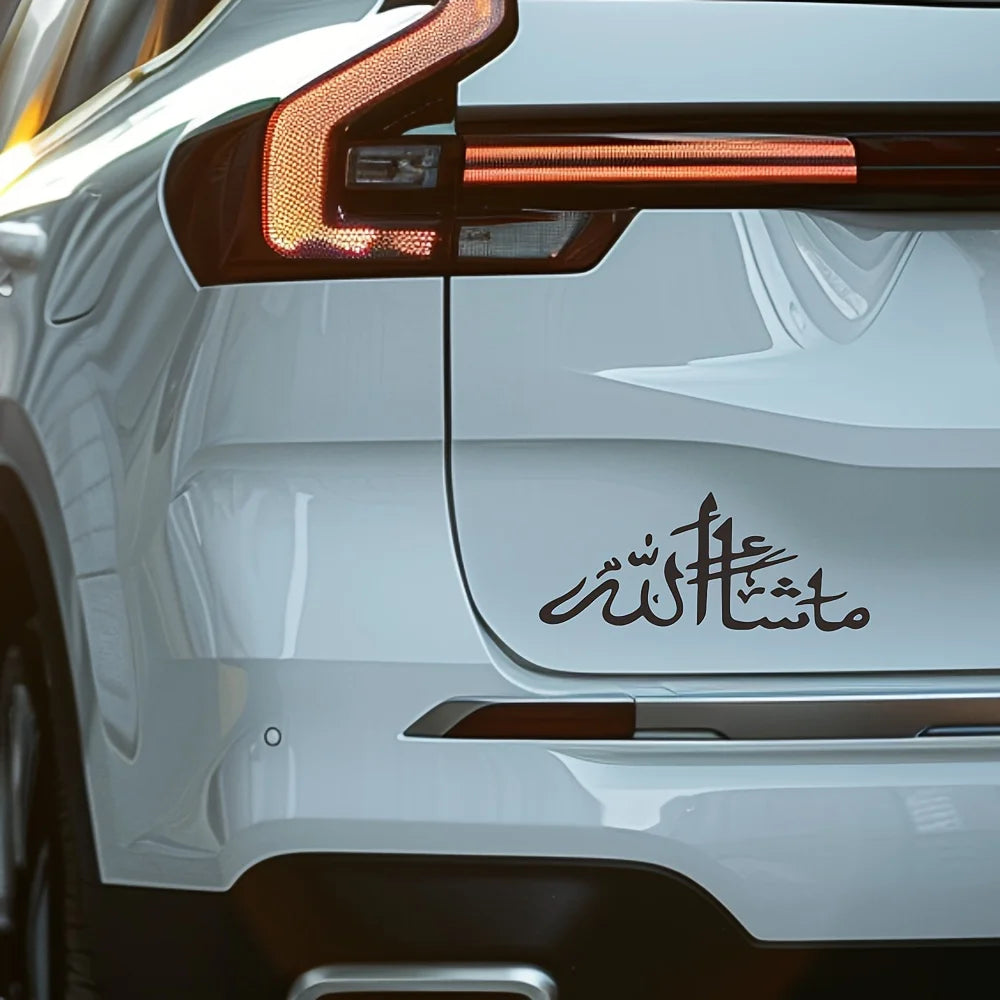 Close-up of a white car's taillight and rear panel featuring black Islamic calligraphy vinyl decal.