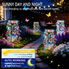 Solar garden lights with a firework starburst effect illuminating a pathway and garden at night