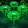 Feux d'artifice LED solaires verts illuminant un jardin avec des explosions sphériques lumineuses.