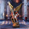 Bronzed Saint Michael Archangel resin figurine with golden wings and a sword standing over a fallen figure.