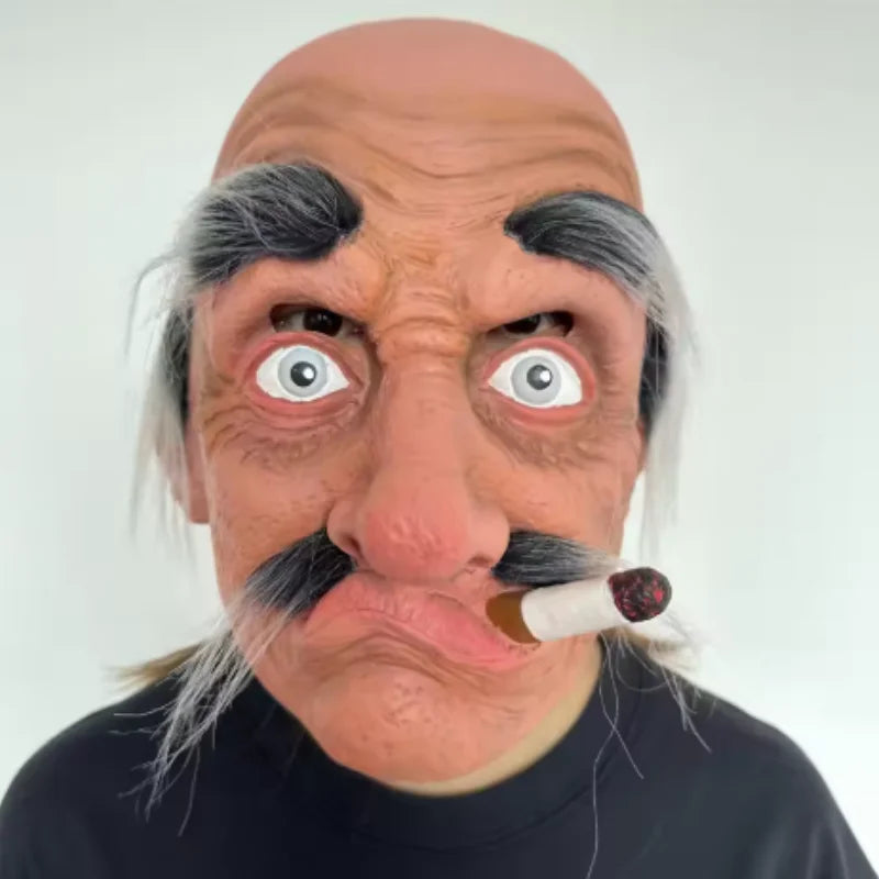 A realistic cute alien full-face latex mask with gray facial hair and a cigarette on the mouth.
