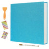 A turquoise linen scrapbook photo album with a wooden tool and colorful self-adhesive pages displayed on a white background.
