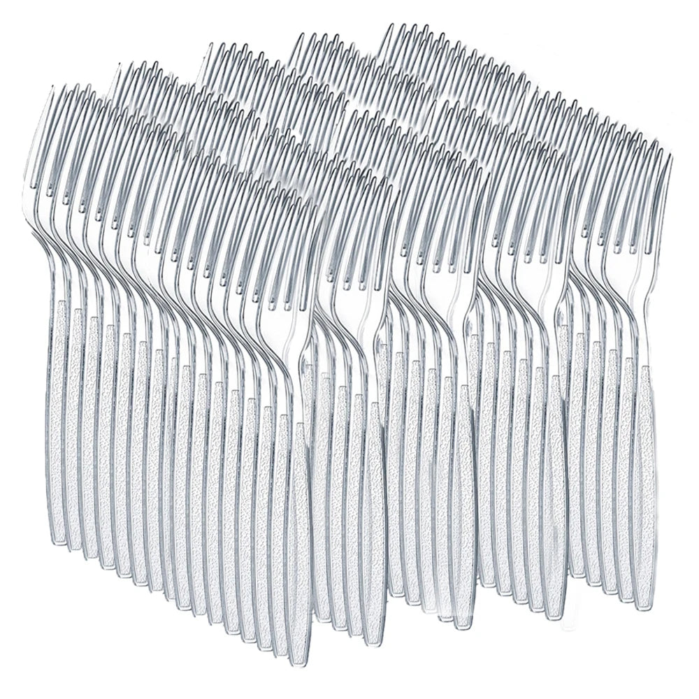 A collection of disposable plastic silverware forks arranged in a row.