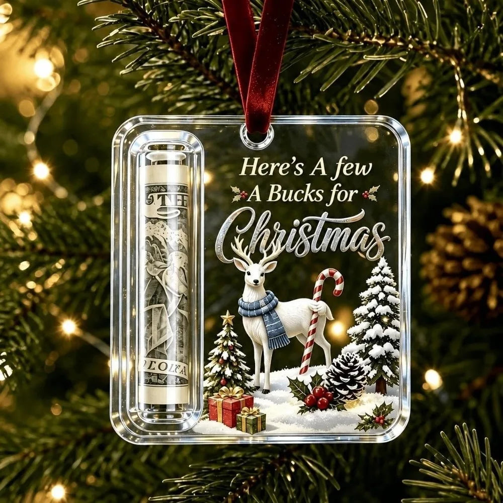 Clear acrylic ornament featuring a white reindeer, Christmas tree, and gift box design with a red velvet ribbon.