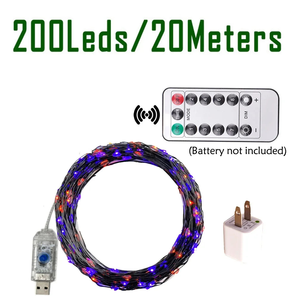 A coil of 20 meters of purple and orange fairy string lights with a remote control and battery holder.
