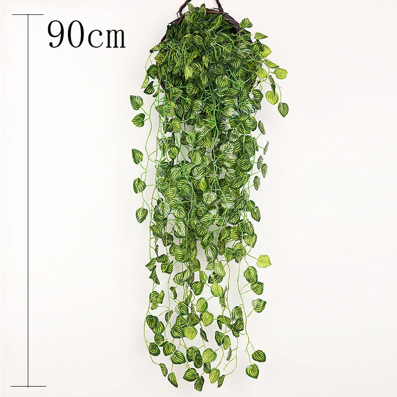 A long, cascading artificial plant vine wall hanging with green leaves.