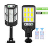 A black solar-powered motion sensor LED security light with a vertical housing and remote control options.