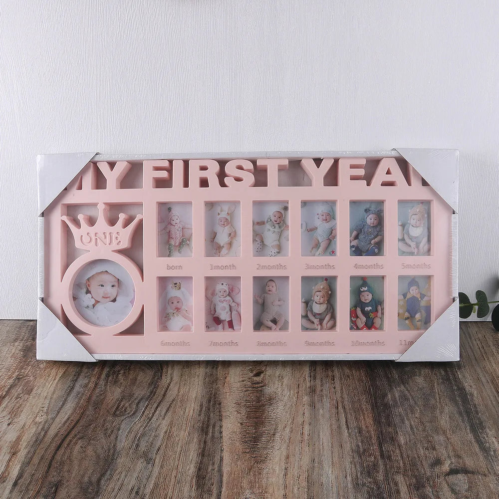 A pink photo frame display showing monthly growth photos of a baby from birth to one year.