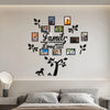 A wall decoration featuring a family tree design with various photo collages and leaves.