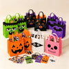 A collection of reusable Halloween candy bags in various colors and designs, including black, purple, orange, and green.