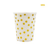A set of ten white disposable cups with gold polka dots.