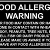 A black sign with white text warning about food allergies, listing potential allergens like wheat, fish, soy, peanuts, tree n