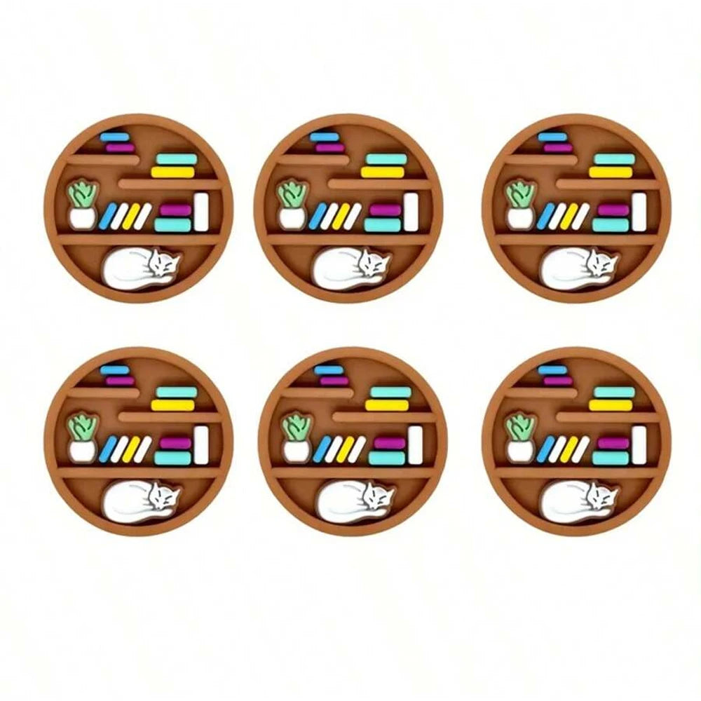 Six circular wooden trays filled with colorful silicone beads, including small plants and cat figures.