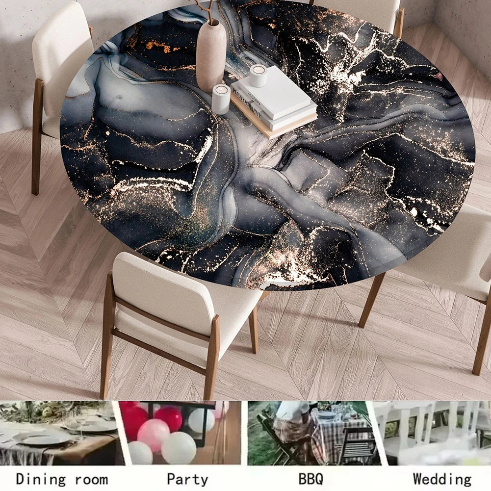 A round table set for dining, featuring a dark marble print tablecloth with gold accents.