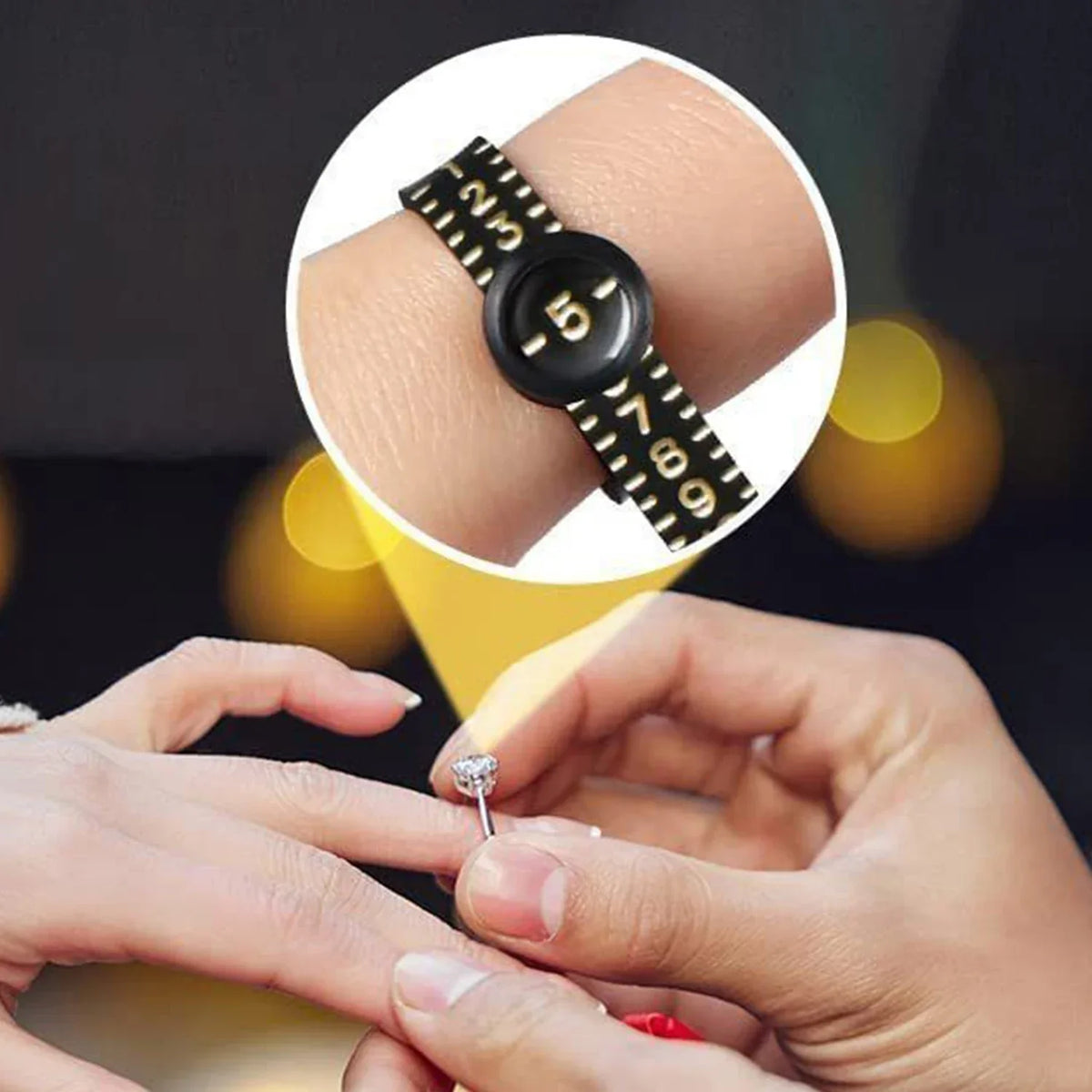 A hand holds a silver ring and a close-up inset shows an adjustable black watch or bracelet with numbers.