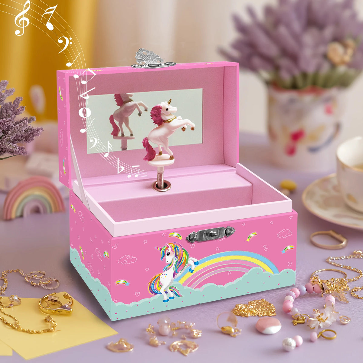 A pink jewelry box shaped like a unicorn, featuring a rotating dancer figurine and colorful accessories.