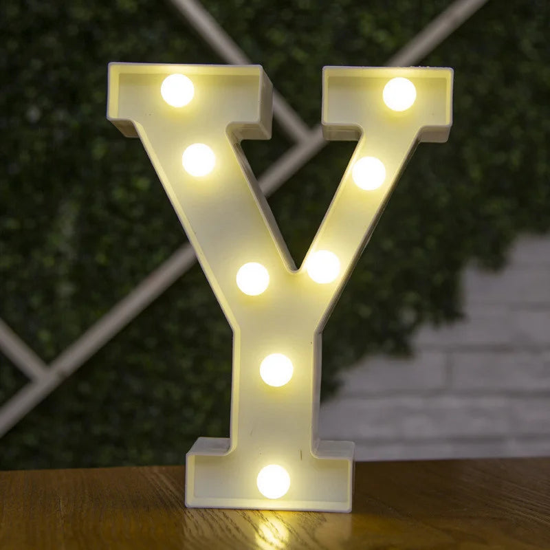 A glowing warm white LED alphabet letter light shaped like the letter Y
