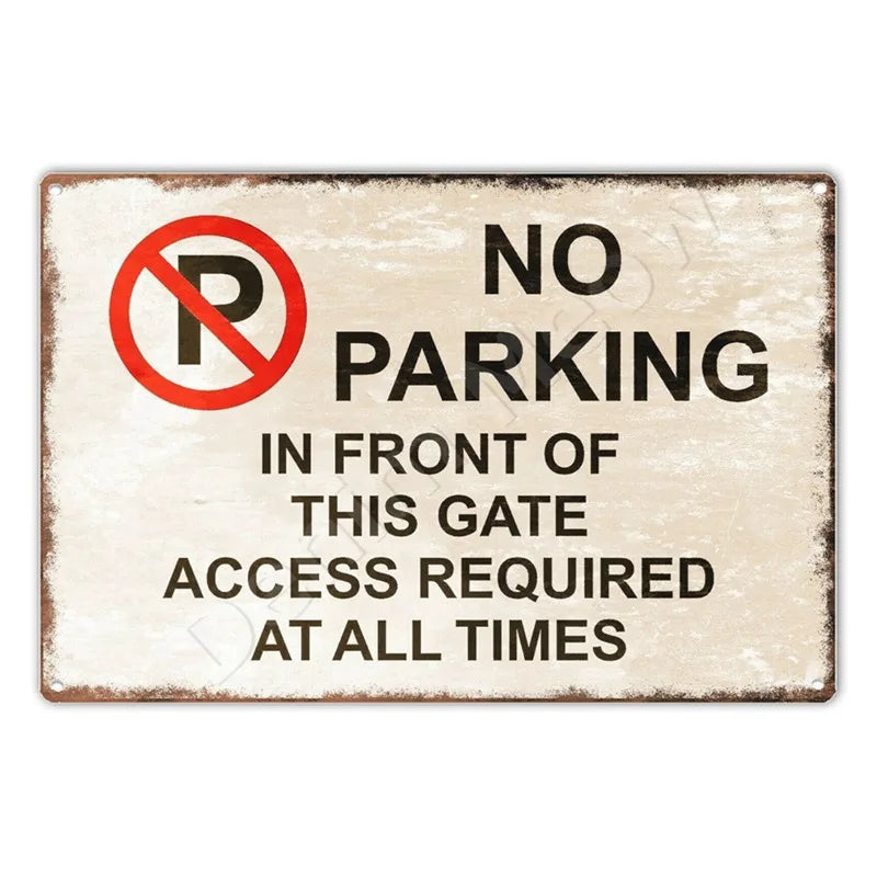 A rectangular metal sign with a red circle and slash over the letter P indicating no parking in front of a gate.