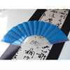 A blue glitter folding fan with transparent ribs displayed against a dark background.