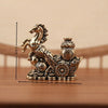 A solid copper figurine of a horse for prosperity and positive energy, displayed on a wooden surface.