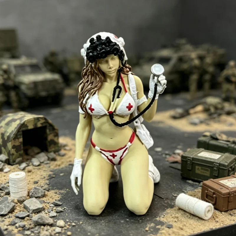 A female rifleman desktop figurine wearing a white and red uniform and holding a rifle.