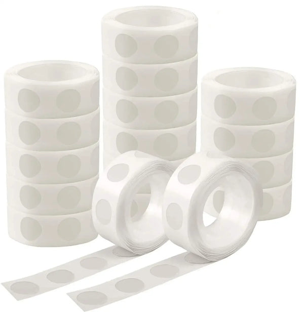 White removable double-sided adhesive dots packaged in stacks and rolls for balloons and crafts