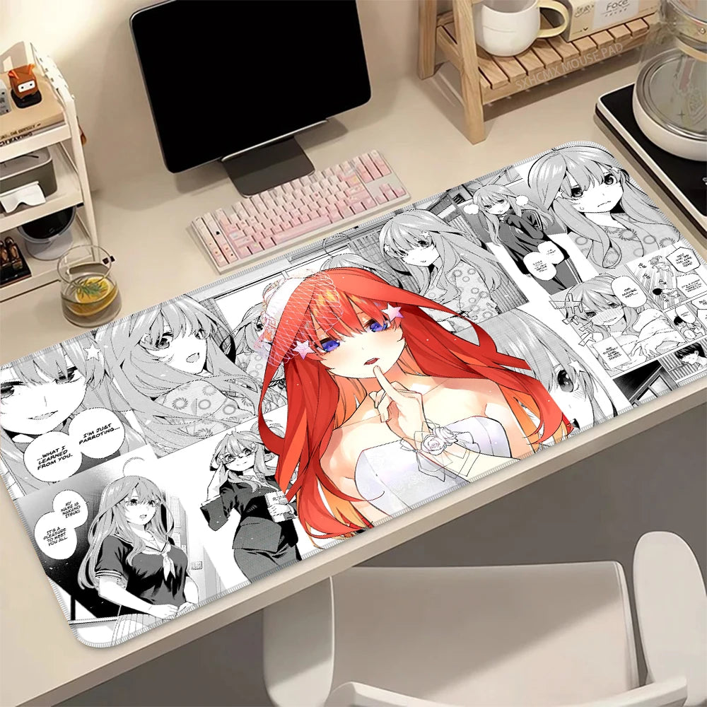 A desk mat featuring illustrations of the Quintessential Quintuplets anime characters with a non-slip rubber base.