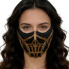 A woman wearing a black and gold Mortal Kombat Sub-Zero and Scorpion cosplay half-face mask.