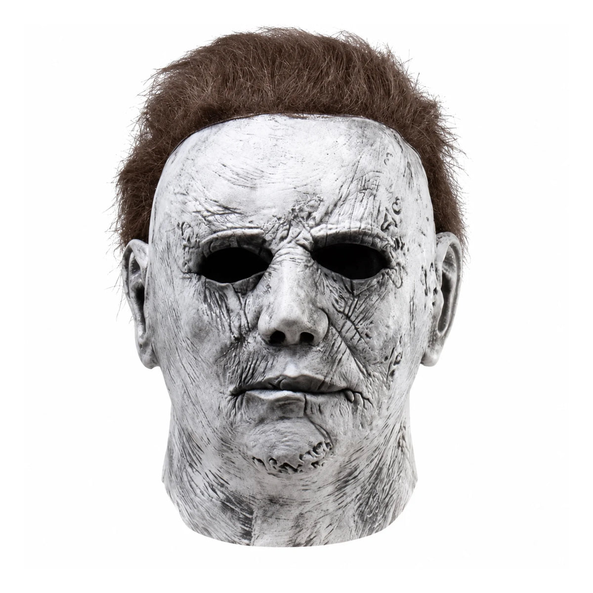 A realistic latex mask of a pale, scarred face resembling Michael Myers for Halloween.