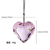 Pink crystal heart prism sun catcher pendant hanging by a black cord