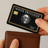 A black white privilege exclusive membership card is held over a brown leather wallet.