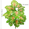 A lush artificial monstera plant featuring 24 large, green leaves with pink accents.