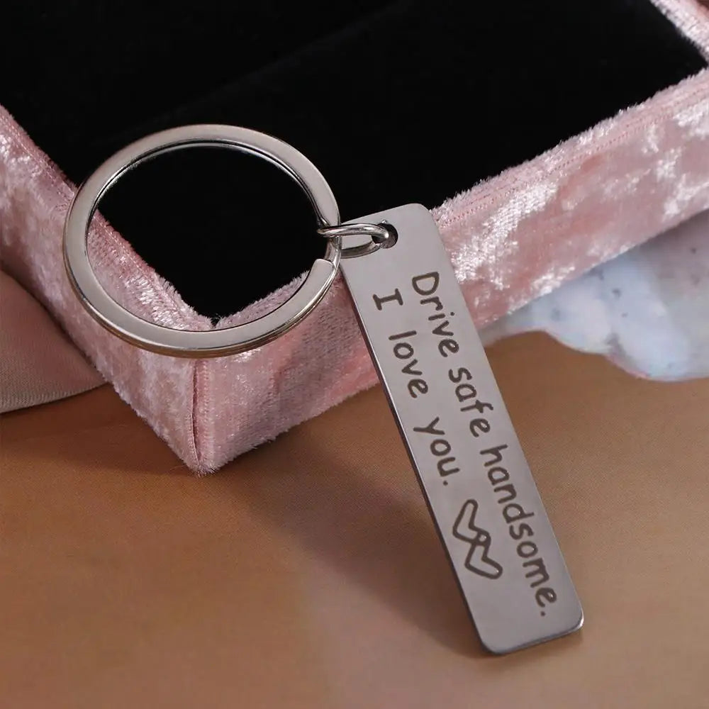 Silver stainless steel keychain engraved with the message I drive I love you handsome