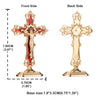 A gold-colored metal crucifix desk cross with a decorative finish and self-adhesive base.