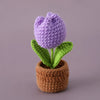 Handcrafted crochet purple tulip plant in a brown crocheted pot