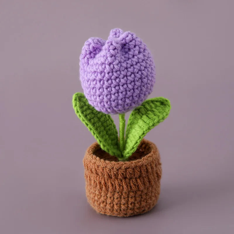Handcrafted crochet purple tulip plant in a brown crocheted pot
