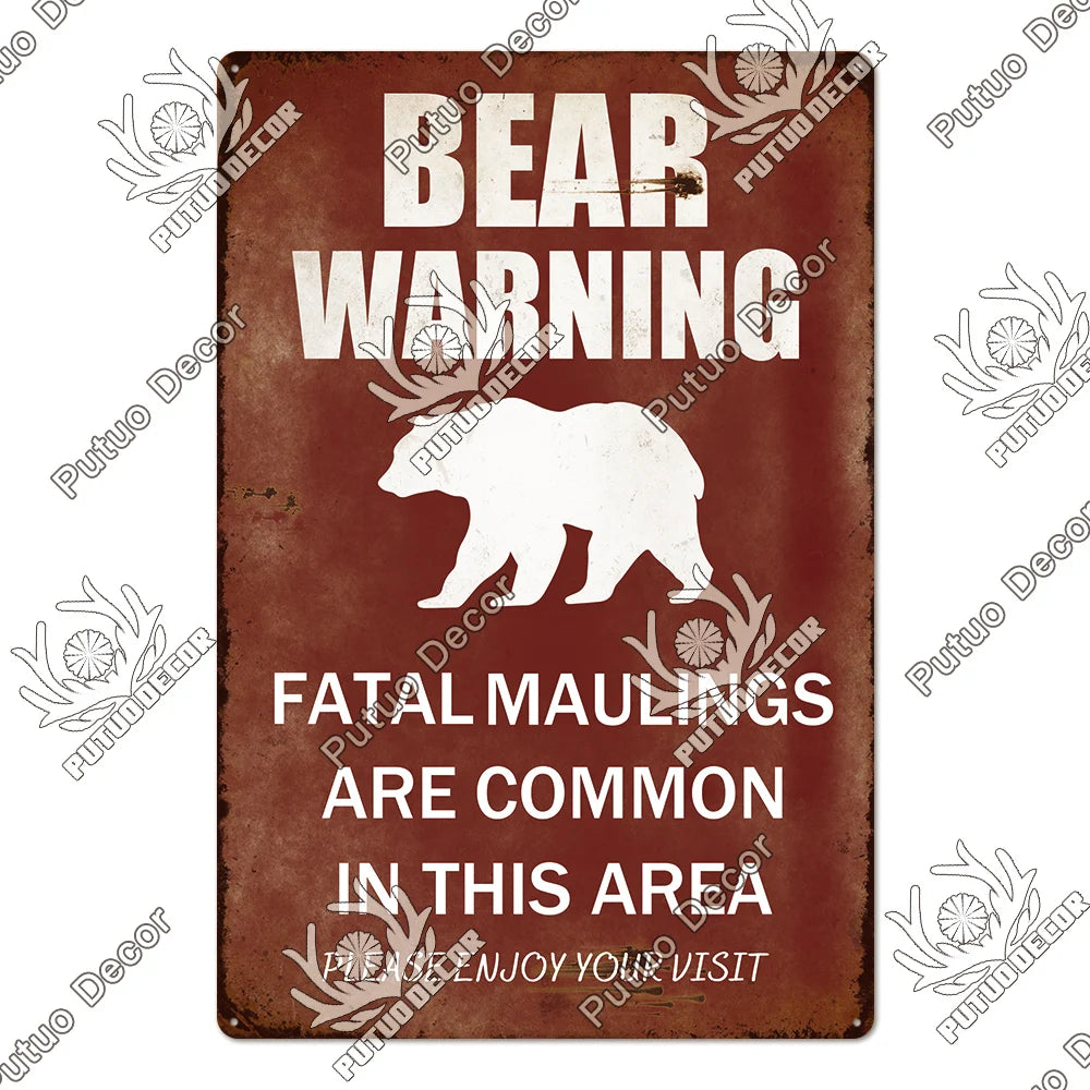Vintage metal sign with a bear warning featuring text that fatal maulings are common in this area