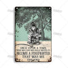 Vintage metal sign featuring a firefighter silhouette against a leafy background.
