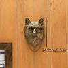A bronze deer head storage hook wall decor mounted on a wooden panel with a measurement scale.