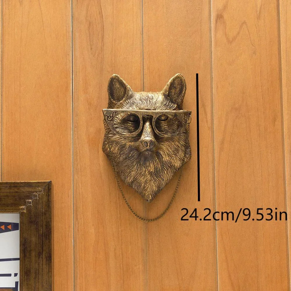 A bronze deer head storage hook wall decor mounted on a wooden panel with a measurement scale.