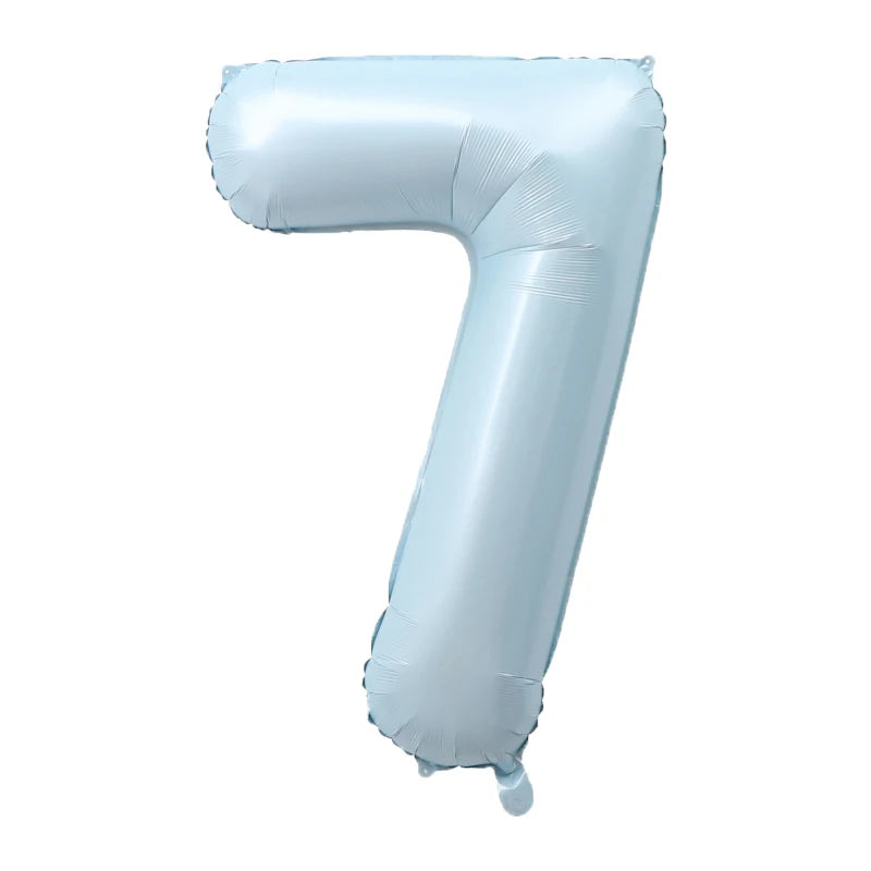 A light blue foil number balloon shaped like the number 7.