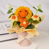 Handmade crochet sunflower bouquet with orange and yellow flowers in a light pink gift box
