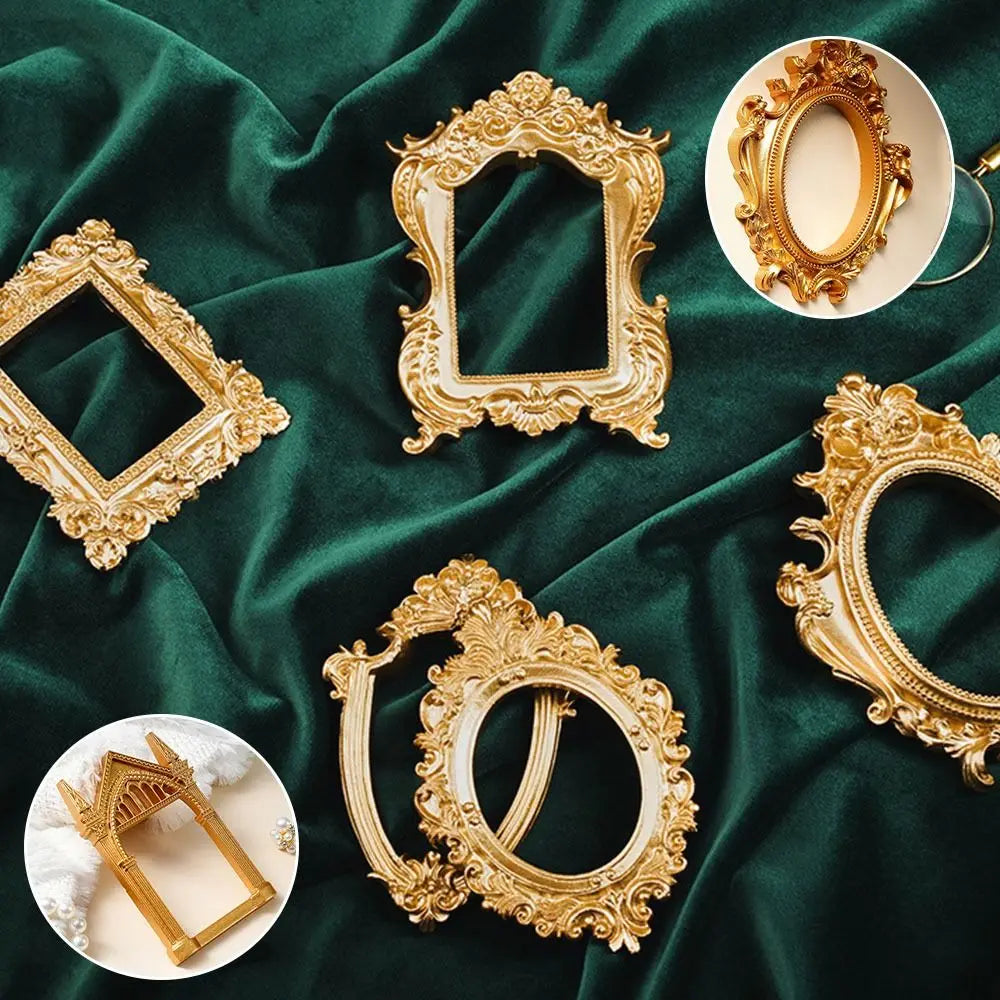 Various vintage gold DIY shadow box frames and decorative ornate gold picture frames displayed on a dark green velvet fabric.