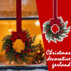 A festive Christmas garland featuring a green wreath with red berries and a large red velvet bow against a red background.